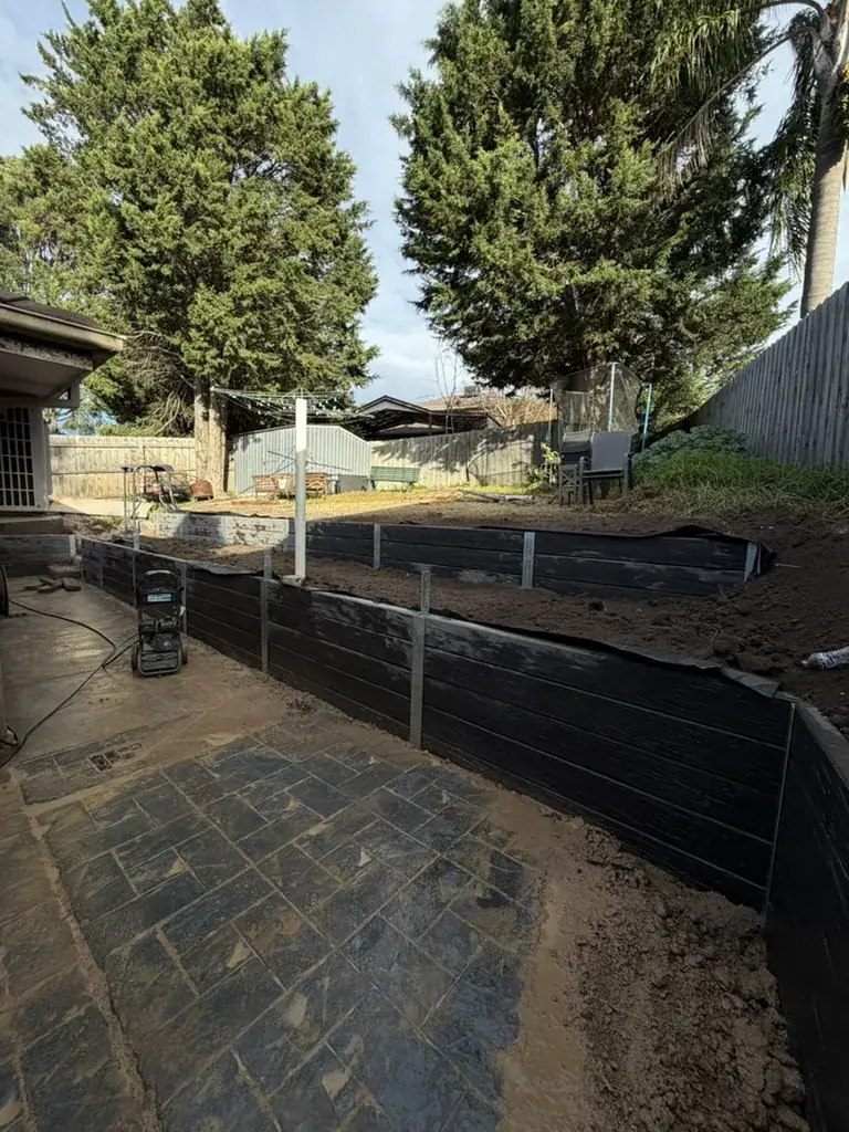 Black concrete sleeper walls