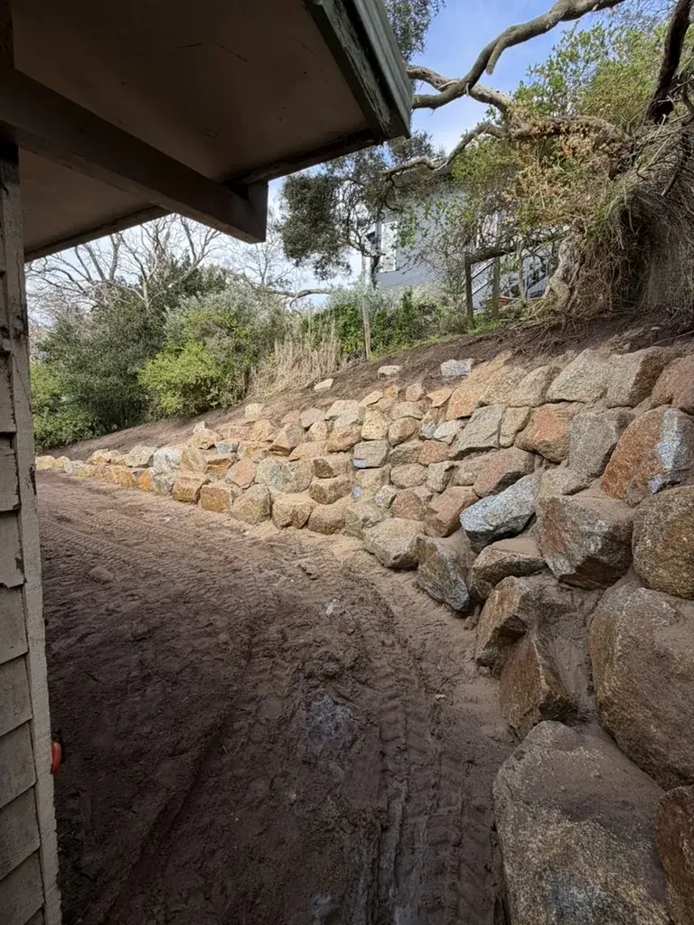 Natural rock retaining wall