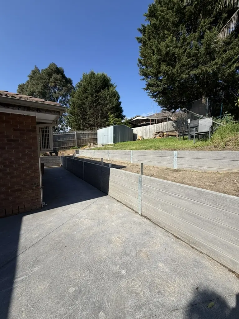 Tiered concrete sleeper retaining walls