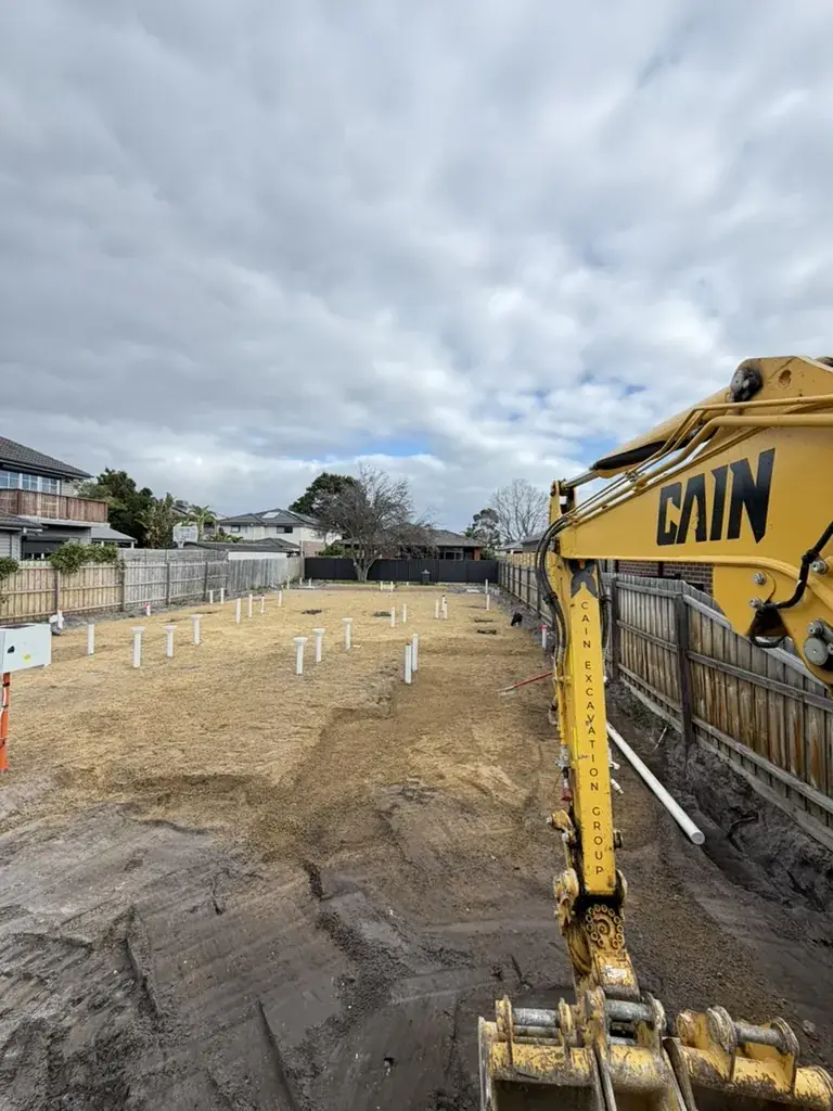 CEG excavator digging a residential site cut in Melbourne